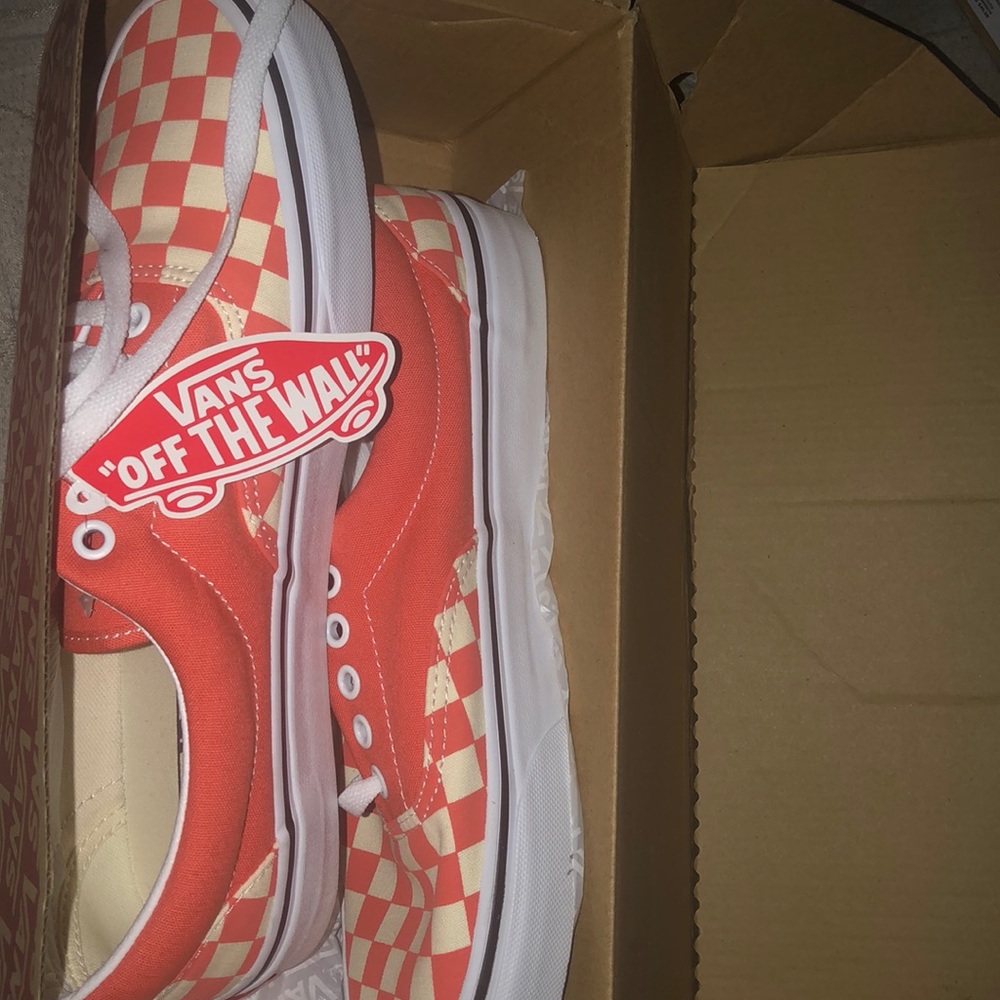 Salmon colored checkered vans
